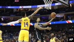 Brooklyn Nets' Wilson Chandler goes to the basket against Los Angeles Lakers' Danny Green, left, during the Nets' 114-111 preseason win in Shanghai, China, Oct. 10, 2019. 