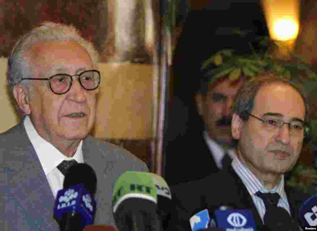 U.N.-Arab League peace envoy for Syria Lakhdar Brahimi (L) speaks next to Syria's Deputy Foreign Minister Faisal Mekdad during a news conference, after meeting Syria's President Bashar al-Assad, in Damascus October 21