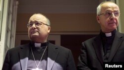 Vatican special envoy Archbishop Charles Scicluna (L) and Apostolic Nuncio to Chile Ivo Scapolo attend a news conference in Santiago after meeting with victims of sexual abuse allegedly committed by members of the church, in Santiago, Chile, Feb. 20, 2018