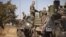 French soldiers refuel armored personnel carriers that were driven into the Malian capital from Ivory Coast, at a air base in Bamako, January 15, 2013. 