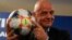 FIFA President Gianni Infantino holds the official ball of the upcoming Women's Soccer World Championship during a press conference at the end of an executive committee meeting in Rome, Feb. 27, 2019.