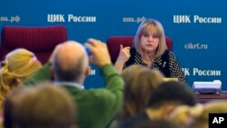 FILE - Ella Pamfilova, head of the Russian Central Election Commission, facing camera, speaks at commission headquarters in Moscow, Russia, Sept. 15, 2016.