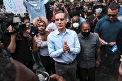 Los Angeles Mayor Eric Garcetti arrives to appeal to Black Lives Matter protesters in downtown Los Angeles on June 2, 2020.