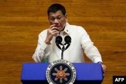 FILE - Philippine's then-President Rodrigo Duterte delivers his annual state of the nation address at the House of Representatives in Manila, July 26, 2021.