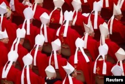 Cardinals sit ahead of the funeral of former Pope Benedict at the Vatican, Jan. 5, 2023.