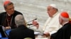 FILE - Maltese cardinal Mario Grech (L), Pope Francis (C) and cardinal Carlos Aguiar Retes attend the Second Session of the 16th Ordinary General Assembly of the Synod of Bishops at the Paul VI audience hall, in The Vatican, Oct. 2, 2024. 