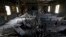 Burned pews, destroyed musical instruments, Bibles and hymnals are part of the debris inside the fire damaged Hopewell M.B. Baptist Church in Greenville, Mississippi, Nov. 2, 2016. 