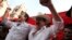 Opposition leader Salvador Nasralla, left, cheers along with former President Manuel Zelaya, at a rally where he reaffirmed his claim on the presidency of Honduras, in the central park of San Pedro Sula, Honduras, Jan. 6, 2018. 
