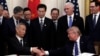 President Donald Trump shakes hands with Chinese Vice Premier Liu He, after signing a trade agreement in the East Room of the White House, Jan. 15, 2020, in Washington.