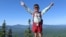 In this July 23, 2021 family photograph provided by Joshua Sutton, five-year-old Harvey Sutton raises his arms on a mountain top in Bigelow Preserve, Maine, while hiking the Appalachian Trail with his Mom and Dad.
