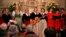 The Kroell Family Singers, center, sing "Silent Night" with the Choir of Trinity Wall Street and Trinity Youth Chorus during a celebration of the anniversary of the song at Trinity Church, Nov. 27, 2018, in New York.