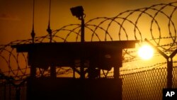 FILE - The sun rises above Camp Delta at Guantanamo Bay Naval Base, Cuba. Five Taliban commanders were released by the United States in a prisoner swap to win the freedom of U.S. soldier Sgt. Bowe Bergdahl on May 31, 2014.