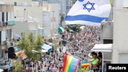 Revellers take part in an annual gay pride parade in Tel Aviv, Israel June 14, 2019.