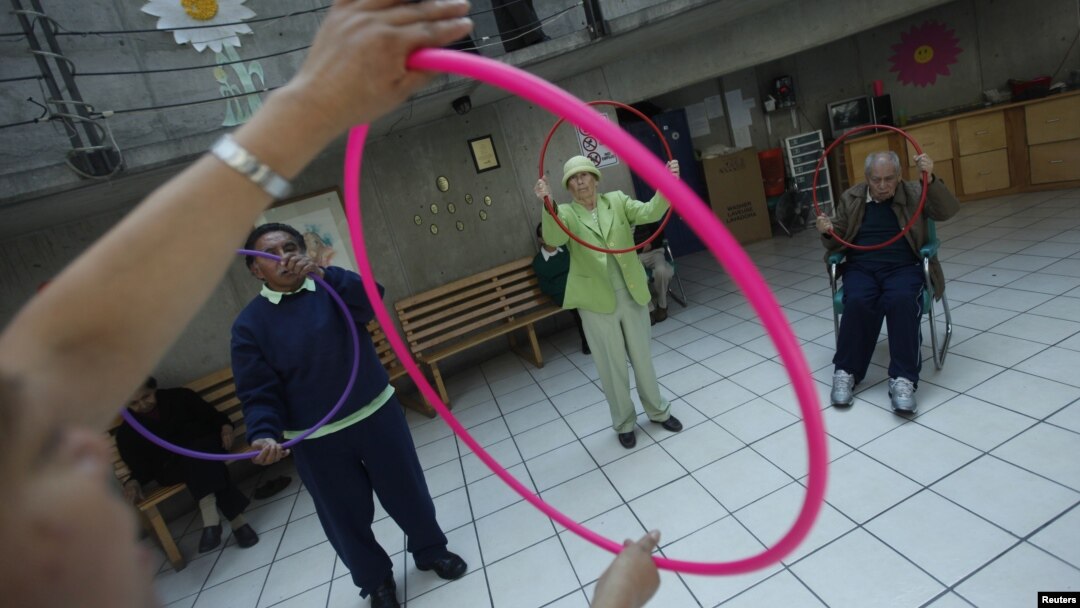 Patients with Alzheimer's and dementia during a therapy session inside the Alzheimer foundation in Mexico City, FILE April 19, 2012. 