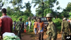 FILE - Congolese soldiers patrol in an area civilians were killed by Allied Democratic Forces rebels, in Beni, eastern Democratic Republic of the Congo, Oct 5, 2018. 