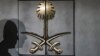 The shadow of a security guard is seen on the entrance door of the Saudi Arabia's consulate in Istanbul, on Oct. 12, 2018.
