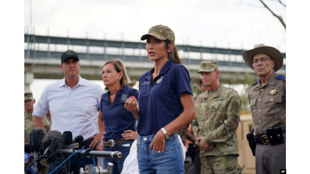 FILE - South Dakota Governor Kristi Noem, center, is joined by other Republican governors as she speaks during a news conference along the Rio Grande on Aug. 21, 2023, in Eagle Pass, Texas.