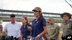 South Dakota Governor Kristi Noem, center, is joined by other Republican governors as she speaks during a news conference along the Rio Grande on Aug. 21, 2023, in Eagle Pass, Texas.