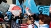 FILE - Uyghurs and their supporters rally across the street from United Nations headquarters in New York City, March 15, 2018. As Donald Trump’s second White House term nears, Uyghur American advocates push for tougher action on China’s Xinjiang policies.