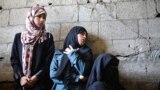 Palestinian relatives of Tawfiq al-Aga, who medics said was killed in Israeli shelling, mourn during his funeral in Khan Younis in the southern Gaza Strip.