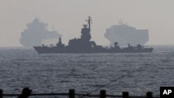 Israeli naval battle ship sails after escorting the vessel the Dignity al-Karama towards the port of Ashdod ,Israel, July 19, 2011