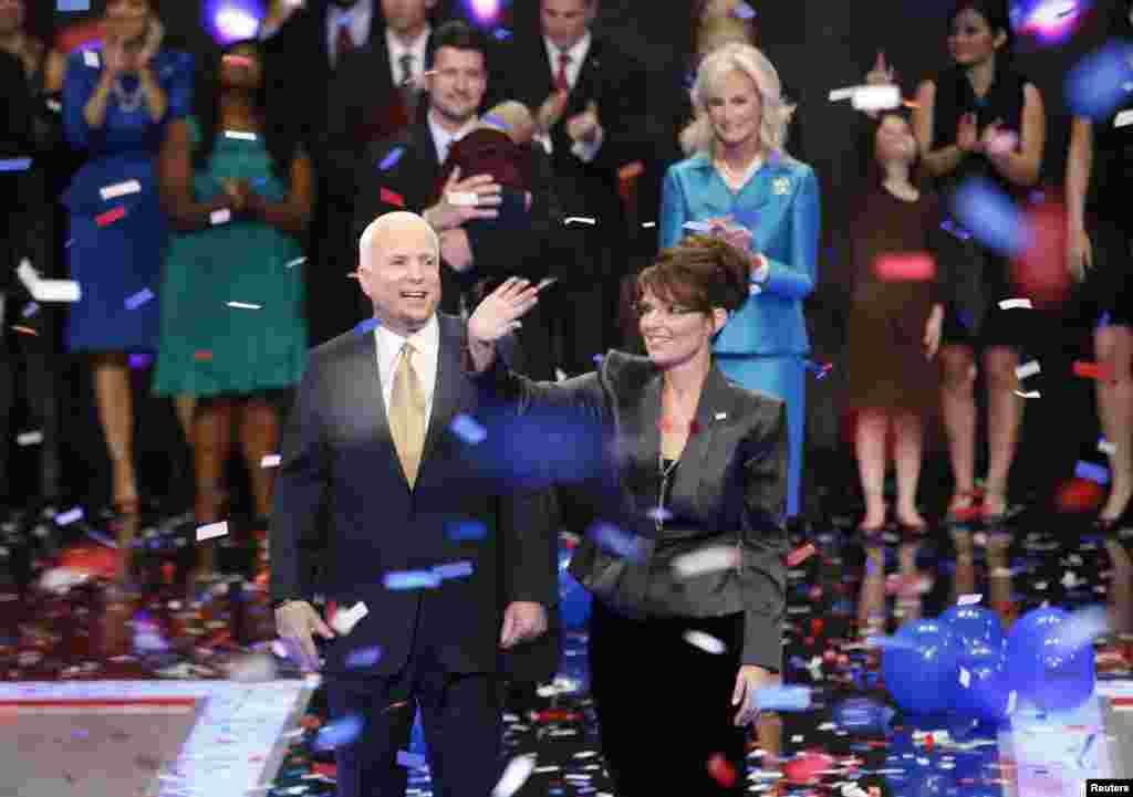 FILE - Presidential nominee John McCain stands amid falling confetti with vice presidential nominee Alaska Governor Sarah Palin after he accepted the presidential nomination at the 2008 Republican National Convention in St. Paul, Minnesota Sept. 4, 2008.