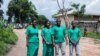 FILE - From left, journalists Christine Kamikazi, Agnes Ndirubusa, Terence Mpozenzi and Egide Harerimana leave High Court in Bubanza, Burundi, Dec. 30, 2019, after attending a trial session. The four, sentenced on a security charge, have been pardoned.