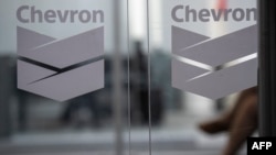 FILE - Chevron Global Technology Services Company logos are seen at an administrative office in Caracas, Venezuela, on Nov. 29, 2022. 