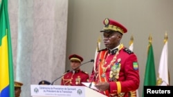 FILE - Gabon coup leader General Brice Oligui Nguema speaks after being sworn in as interim president during his swearing-in ceremony, in Libreville, Gabon, September 4, 2023. 