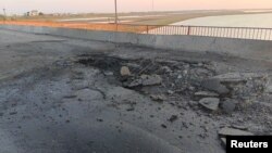 A view shows the damaged Chonhar bridge connecting Russian-held parts of Ukraine's Kherson region to the Crimean peninsula