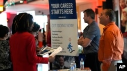 FILE - Prospective job applicants attend a job fair, in Sunrise, Florida, Aug. 29, 2024. 