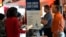 FILE - Prospective job applicants attend a job fair, in Sunrise, Florida, Aug. 29, 2024. 
