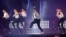 South Korean rapper PSY, in checkered jacket, performs "Gentleman" in a concert entitled "Happening," Seoul, April 13, 2013.