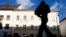 FILE - A person passes the house in which Nazi dictator Adolf Hitler was born in Braunau am Inn, Austria, Sept. 24, 2012.