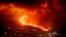 FILE - Lava flows as volcano continues to erupt on the Canary island of La Palma, Spain, Tuesday, Nov. 30, 2021. 