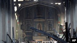 The interior of the San Gabriel Mission is seen in the aftermath of a morning fire, July 11, 2020, in San Gabriel, Calif. The fire destroyed the rooftop and most of the interior of the 249-year-old church, which was undergoing renovation.
