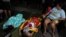 People rest at a makeshift camp outside their apartment building after an earthquake in Yauco, Puerto Rico, Jan. 7, 2020.