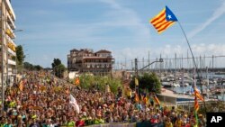 Catalan pro-independence marchers arrive at Arenys de Mar, near Girona, Spain, Oct. 17, 2019. Thousands of people joined five large protest marches across Catalonia that converged on Barcelona. 