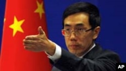 China's Foreign Ministry spokesman Liu Weimin gestures to a journalist during a news conference in Beijing November 21, 2011. REUTERS/David Gray (CHINA - Tags: POLITICS)