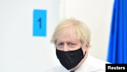 Britain's Prime Minister Boris Johnson visits a coronavirus vaccination site at the Business Design Centre in Islington, London, Britain, May 18, 2021. 