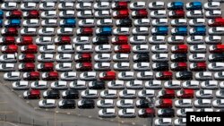 FILE - New Ford vehicles are seen at a parking lot of the Ford factory in Sao Bernardo do Campo, Brazil, Feb. 12, 2015. 