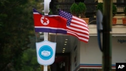 FILE - Flags of North Korea and the U.S are flown on a street in Hanoi, Vietnam, Feb. 19, 2019.