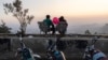 A couple watches the sunset atop Mount Qassioun, which was opened to the public after the fall of the Assad regime, in Damascus, Syria, Jan. 2, 2025.