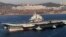 FILE - Chinese aircraft carrier Liaoning cruises back to port after its first navy sea trial in Dalian, northeastern China.