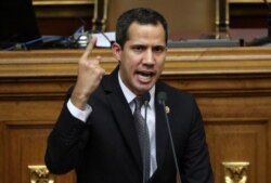 FILE - Venezuelan opposition leader Juan Guaido, who many nations have recognised as the country's rightful interim ruler, gestures as he speaks during a session of the Venezuela's National Assembly in Caracas, Venezuela, July 2, 2019.