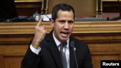 Venezuelan opposition leader Juan Guaido, who many nations have recognised as the country's rightful interim ruler, gestures as he speaks during the session of the Venezuela's National Assembly in Caracas, Venezuela, July 2, 2019. 