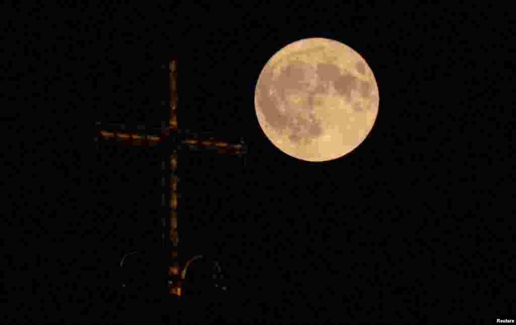 A supermoon, rises over the Alexander Nevsky cathedral in Sofia, Bulgaria, Aug. 19, 2024.