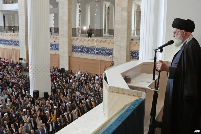A photo provided by the office of the Iranian supreme leader, Ayatollah Ali Khamenei, shows him speaking during the Eid al-Fitr prayer ceremony in Tehran on April 10, 2024. He warned that Israel "must be punished and will be punished” for its attack on Iran's consulate in Syria.