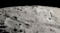 This image provided by NASA shows a view from orbit looking across the surface of the moon, where an ancient asteroid strike carved out a pair of grand canyons on the moon’s far side. (Ernie T. Wright/NASA via AP)