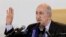FILE - Algerian President Abdelmadjid Tebboune gestures during a press conference in Algiers, Friday, Dec. 13, 2019. 
